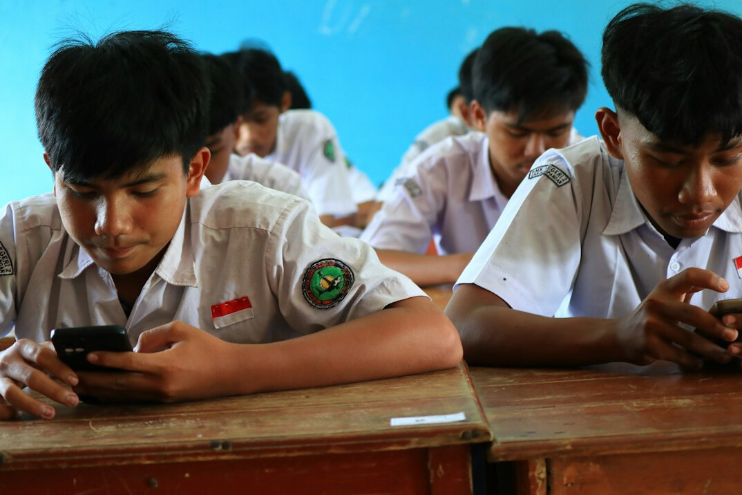 students learning coding in classroom
