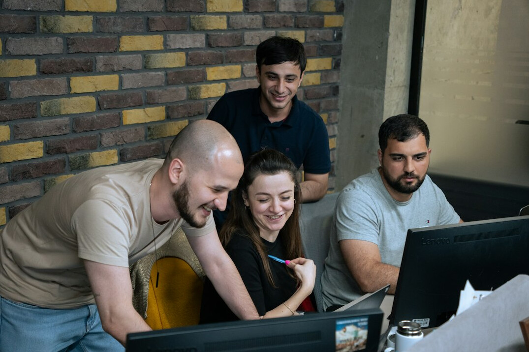 group of students coding together
